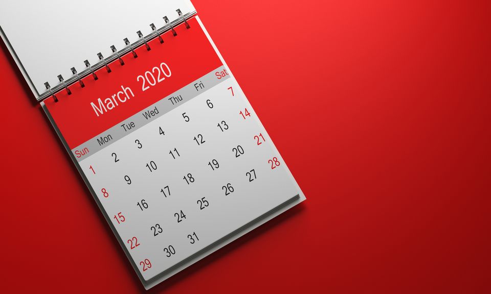 2020 calendar with red cap taken from a well-lit good pain 3d render on red gradient backdrop