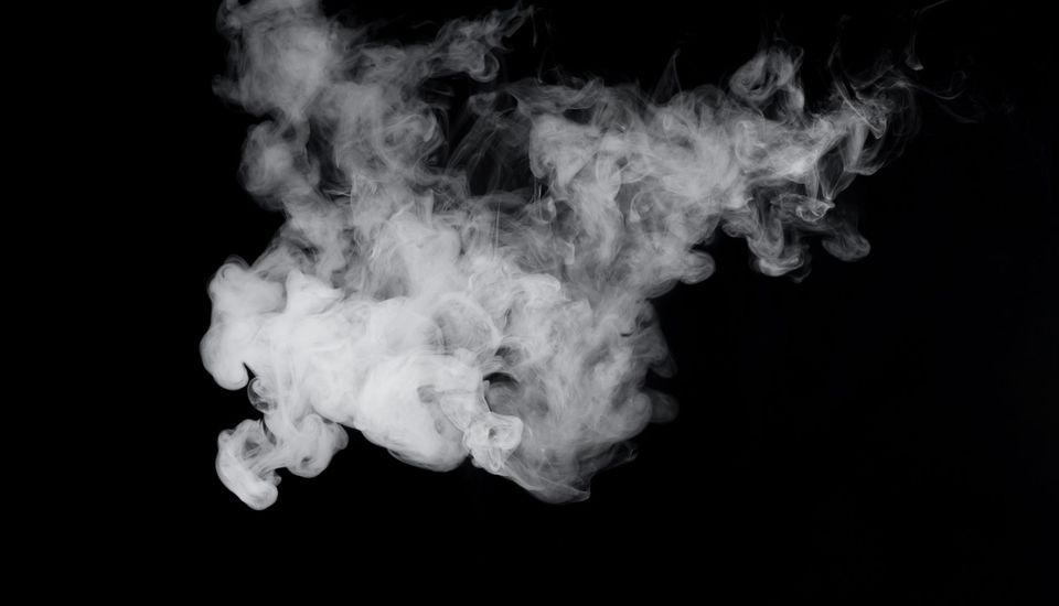 cloud of smoke on black background