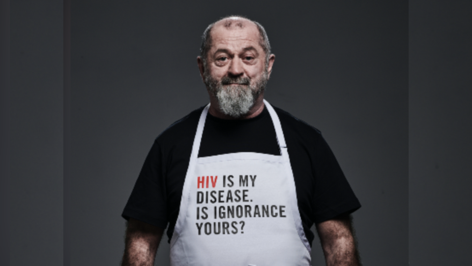 chef allan smash hiv stigma, wearing apron "why is my disease is ignorance yours?"