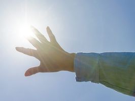 Woman's hand and the Sun