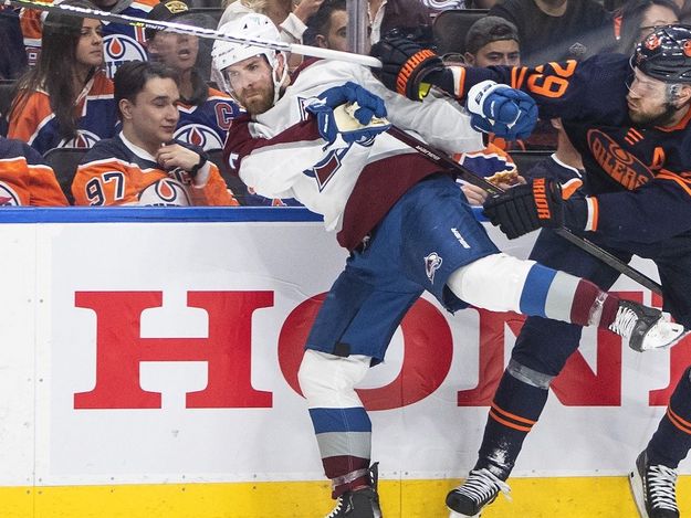 Colorado Avalanche's Devon Toews (7) is checked by Edmonton Oilers' Leon Draisaitl (29) during second period NHL conference finals action in Edmonton on Monday, June 6, 2022.