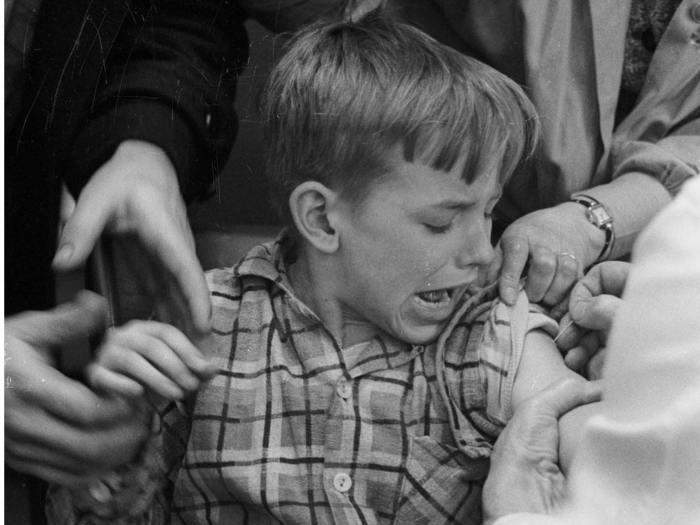 An unnamed Canadian boy being vaccinated in 1959. 