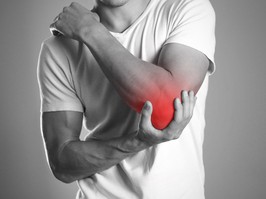 A man holding hands. Pain in the elbow. The hearth is highlighted in red. Close up. Isolated background