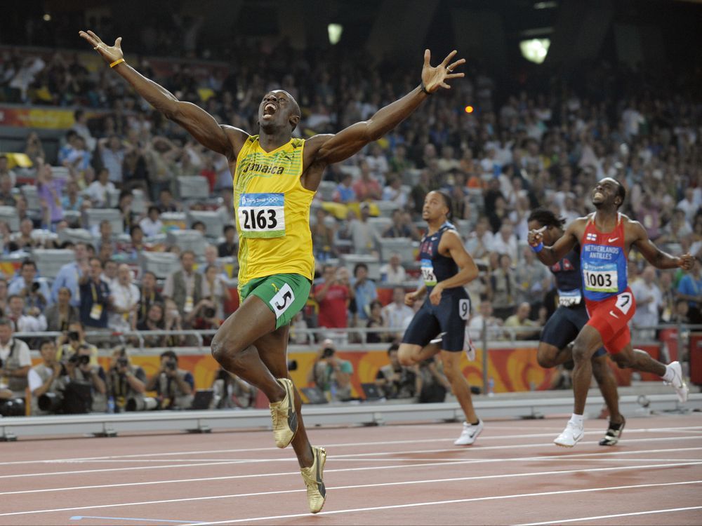 jamaica's usain bolt celebrates as he wins the men's 200-metre final with a world record during the athletics competitions in the national stadium at the beijing 2008 olympics.