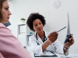 doctor talking with patient