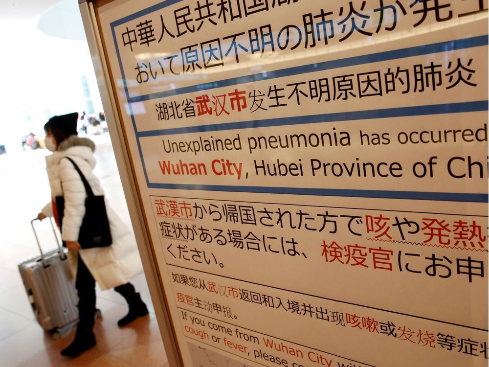 A quarantine notice about the outbreak of coronavirus in Wuhan, China at an arrival hall of Haneda airport in Tokyo.