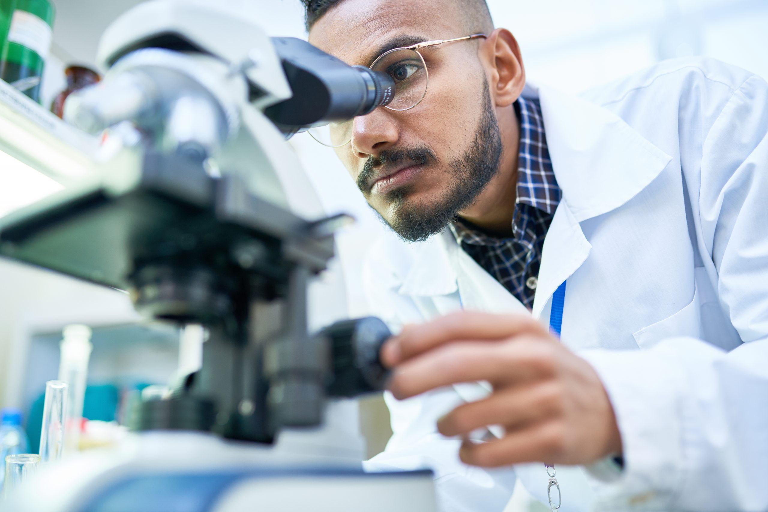 Scientist Using Microscope in Laboratory