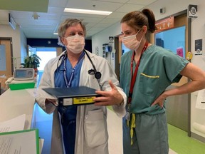 Dr. Jacques Genest and Dr. Geneviève Genest, father and daughter, working together on a COVID-19 unit on June 4 at the MUHC.