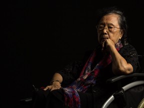 sad asian elder in wheelchair