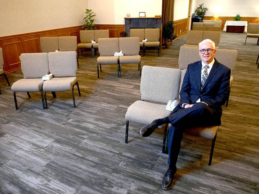 michael pierson, president of pierson's funeral service, poses in the chapel area of the 17 ave se location in calgary on friday, june 5, 2020. funeral sevices have changed due to covid-19 and pierson says he's had a drive thru and video services and has redesigned the seating for social distancing.