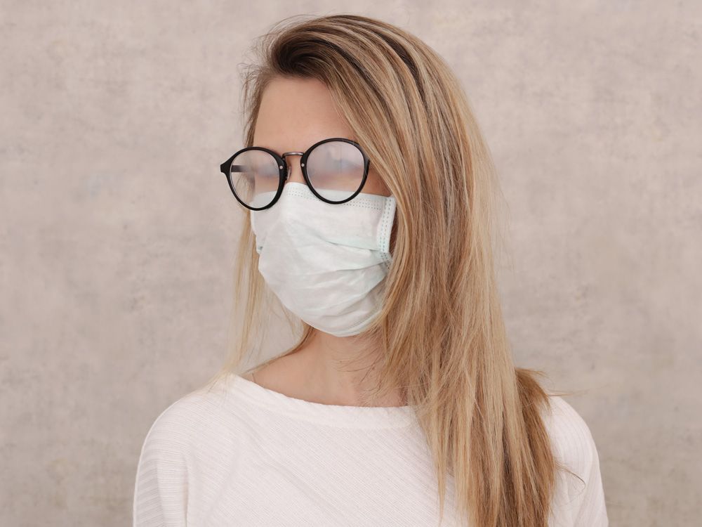 Medical mask and Glasses fogging. Coronavirus prevention, Protection. New habits during Self-isolation , Quarantine