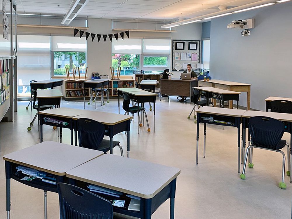 A classroom at L’Ecole Bilingue in the Vancouver school district has desks spaced out and many chairs removed.