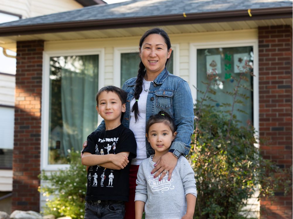 linda moon and her kids eli rawson, 6, and melody rawson, 3, are seen outside of their home in edmonton, on wednesday, aug. 12, 2020. the family has decided that eli will do online learning from home in the fall. photo by ian kucerak/postmedia