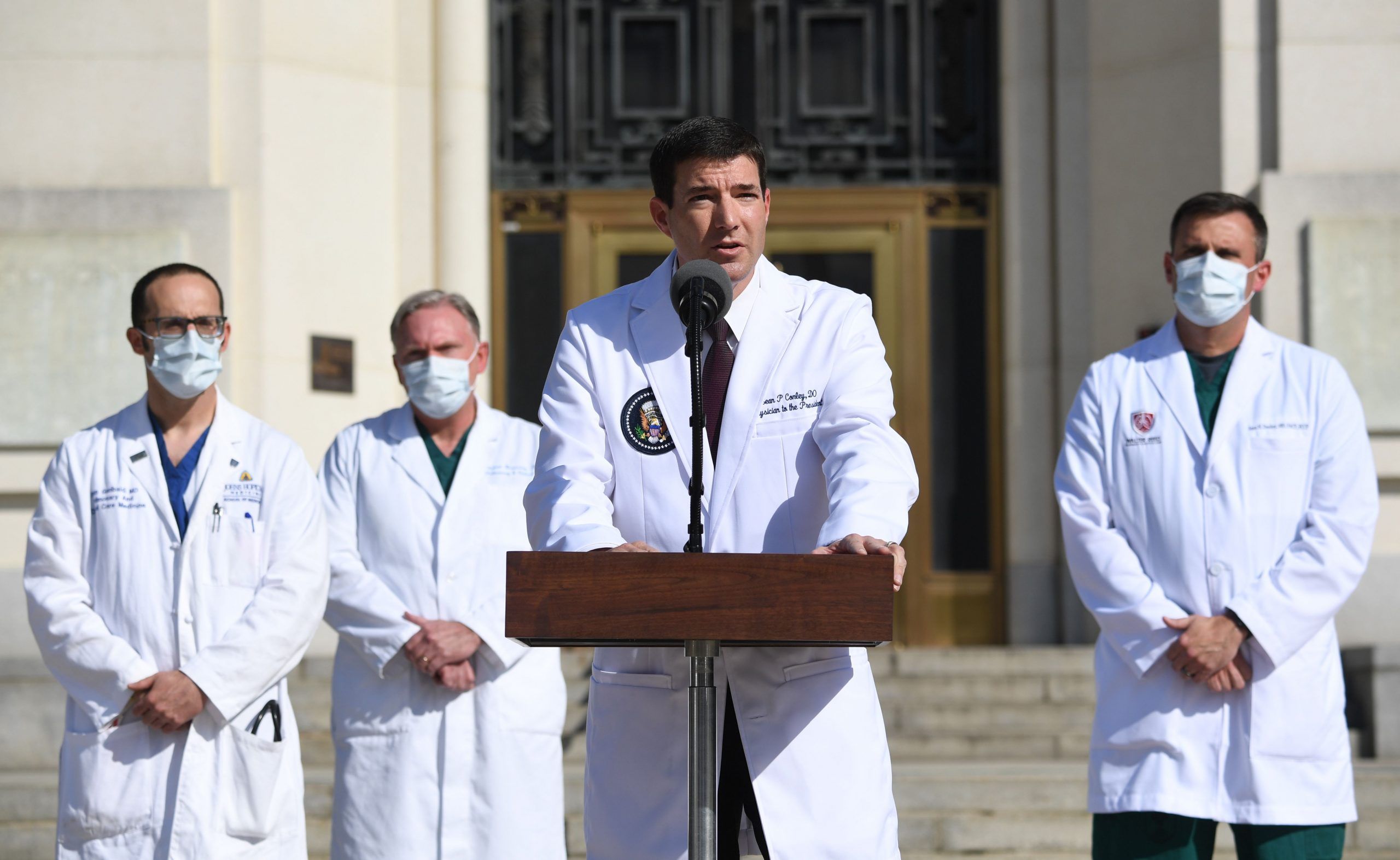 White House physician Sean Conley (centre) answers questions surrounded by other doctors, during an update on the condition of US President Donald Trump, on October 5, 2020, at Walter Reed Medical Center in Bethesda, Maryland. President Donald Trump announced that he is leaving the hospital where he was given emergency treatment for Covid-19 and told the nation, where the virus has killed almost 210,000 people this year, that they have nothing to worry about. 