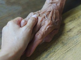 Help concept, hands of the elderly and young