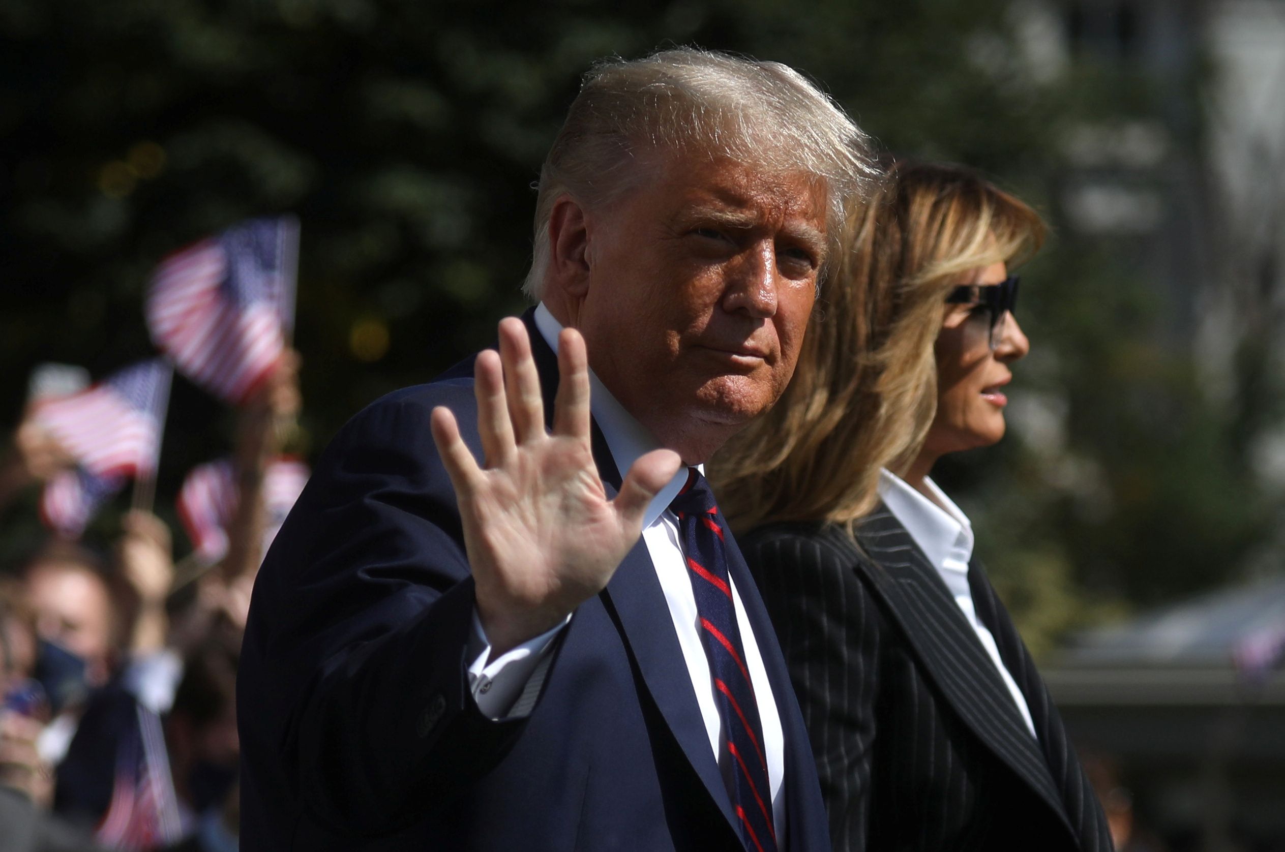 U.S. President Donald Trump waves to reporters as he departs with first lady Melania Trump for campaign travel to participate in his first presidential debate with Democratic presidential nominee Joe Biden in Cleveland, Ohio from the South Lawn at the White House in Washington, U.S., September 29, 2020. President Trump recently announced that he and the first lady have both tested positive for the coronavirus disease (COVID-19). Picture taken September 29, 2020.