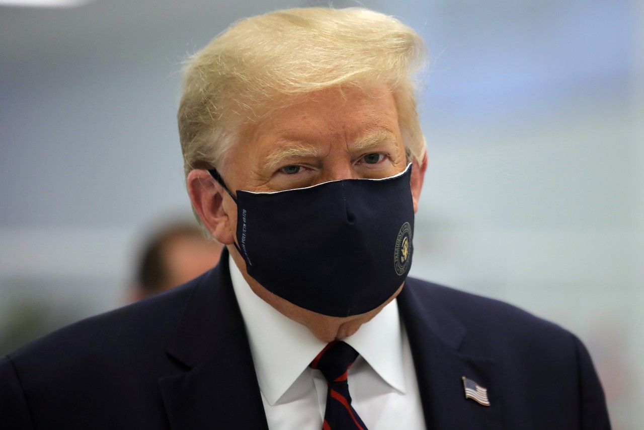 U.S. President Donald Trump wears a protective face mask during a tour of the Fujifilm Diosynth Biotechnologies' Innovation Center, a pharmaceutical manufacturing plant where components for a potential coronavirus disease (COVID-19) vaccine candidate are being developed, in Morrisville, North Carolina, U.S., July 27, 2020. Picture taken July 27, 2020.