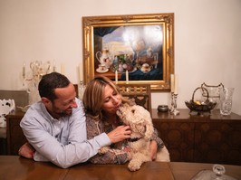 Henry Klumak sits with his wife Rosalind and their dog Leo following a family dinner on September 6, 2019 at their home in Montreal, Quebec.