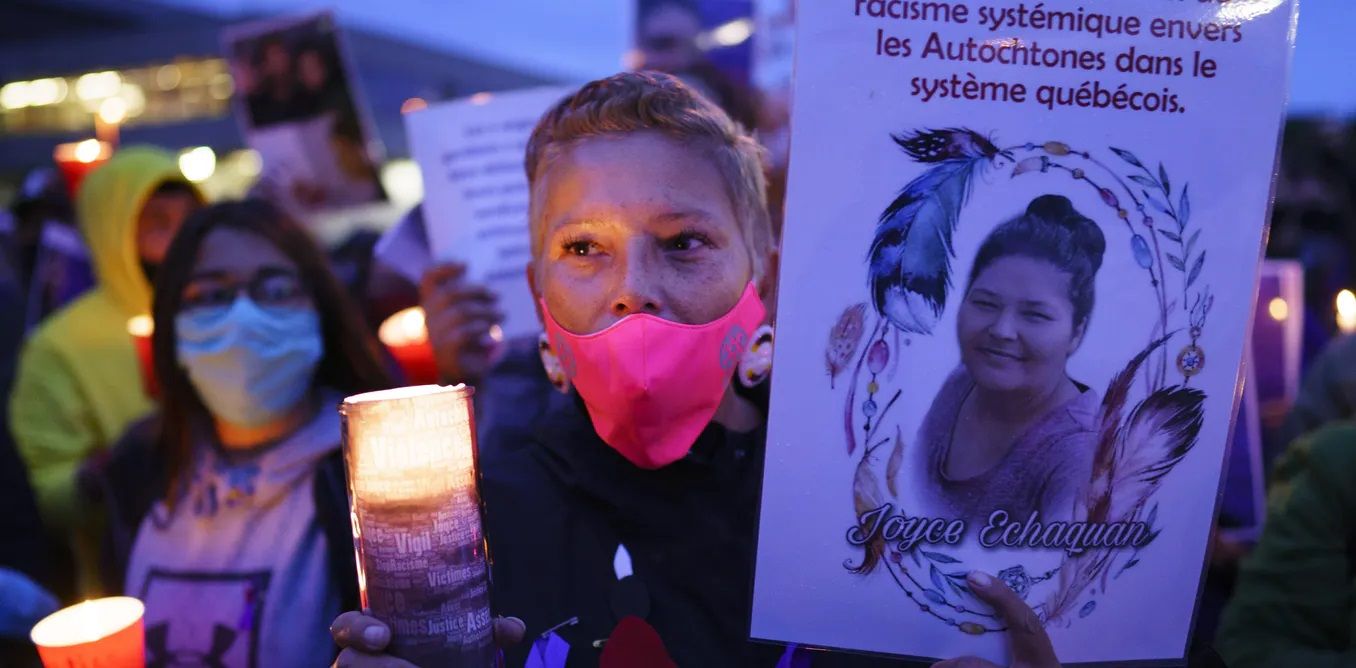 Demonstrators hold a vigil marking the death of Joyce Echaquan, who recorded insults hurled at her by staff at the Joliette, QC, hospital while she was there for treatment.