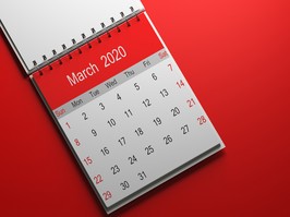 2020 calendar with red cap taken from a well-lit good pain 3d render on red gradient backdrop