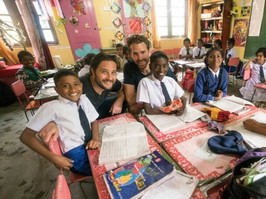 member of Earth Group with schoolchildren