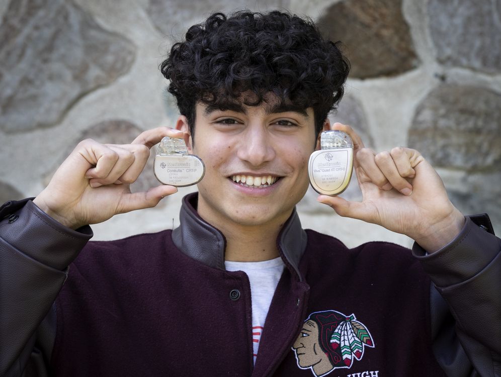 Thomas F. Khairy has become the youngest person to ever have a study published in the prestigious New England Journal of Medecine. He displays a pacemaker, left, and defibrillator in  Montreal, on Thursday, May 7, 2020. 