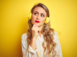 woman wearing yellow headphones