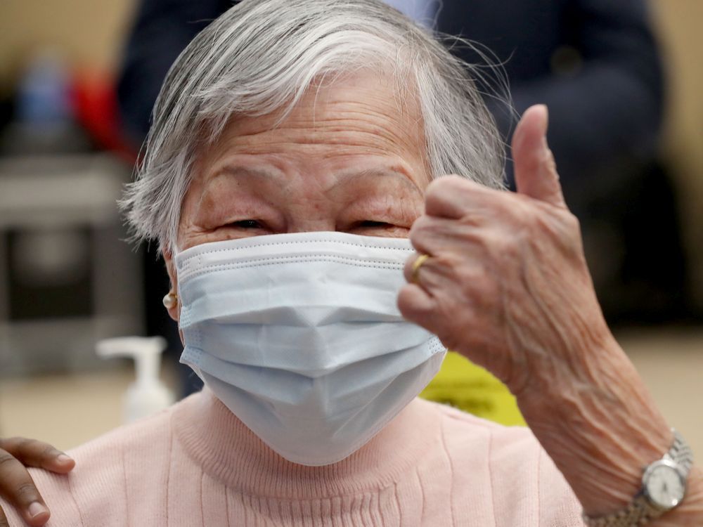 chui ping seto gives the thumbs up after receiving her vaccine from ottawa public health at the the albion-heatherington recreation centre in ottawa on friday, march 5.