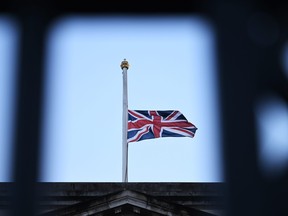 LONDON, ENGLAND - SEPTEMBER 08: The Union Flag flies at half mast at Buckingham Palace in honour of Queen Elizabeth II who died this afternoon on September 8, 2022 in London, England. (Photo by Leon Neal/Getty Images)