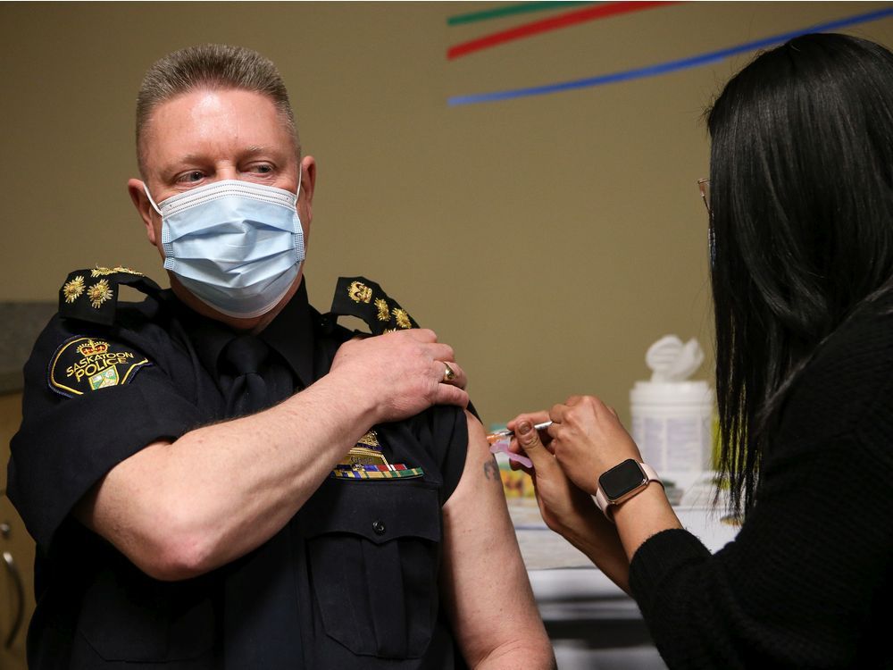 Saskatoon Police Chief Troy Cooper receives his first COVID-19 immunization at the STC clinic at SaskTel Centre. Photo taken in Saskatoon on Wednesday April 21, 2021.