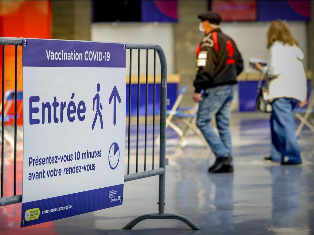 A couple arrive for their appointments at the COVID-19 vaccination centre at the Olympic Stadium in Montreal April 5, 2021.