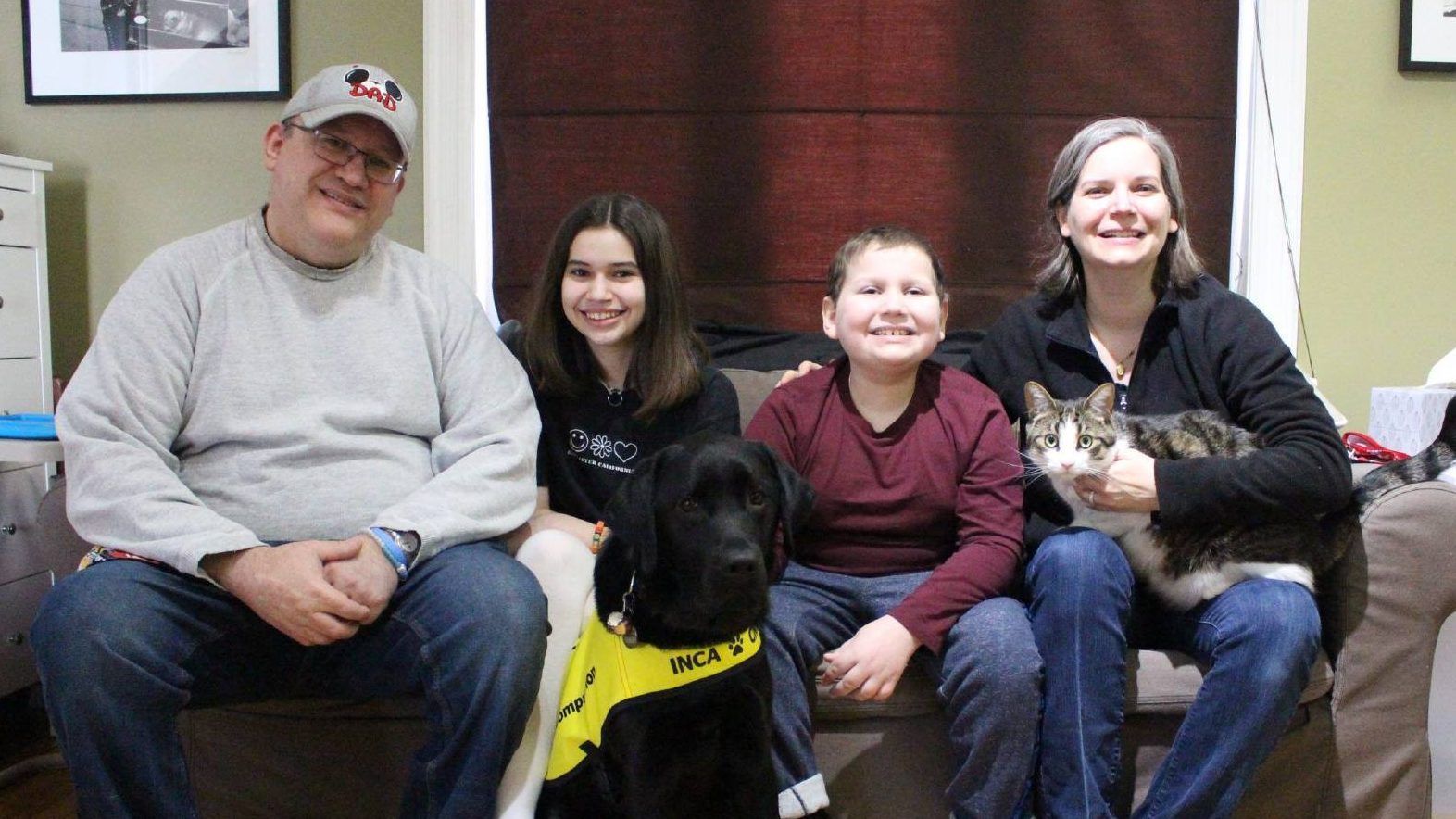 The Acosta-Pickering  family. From Left-right: Mario, Abby, Oliver, Dawn, and Chewbacca their cat. Oliver's dog, Hope, sits in front. SUPPLIED