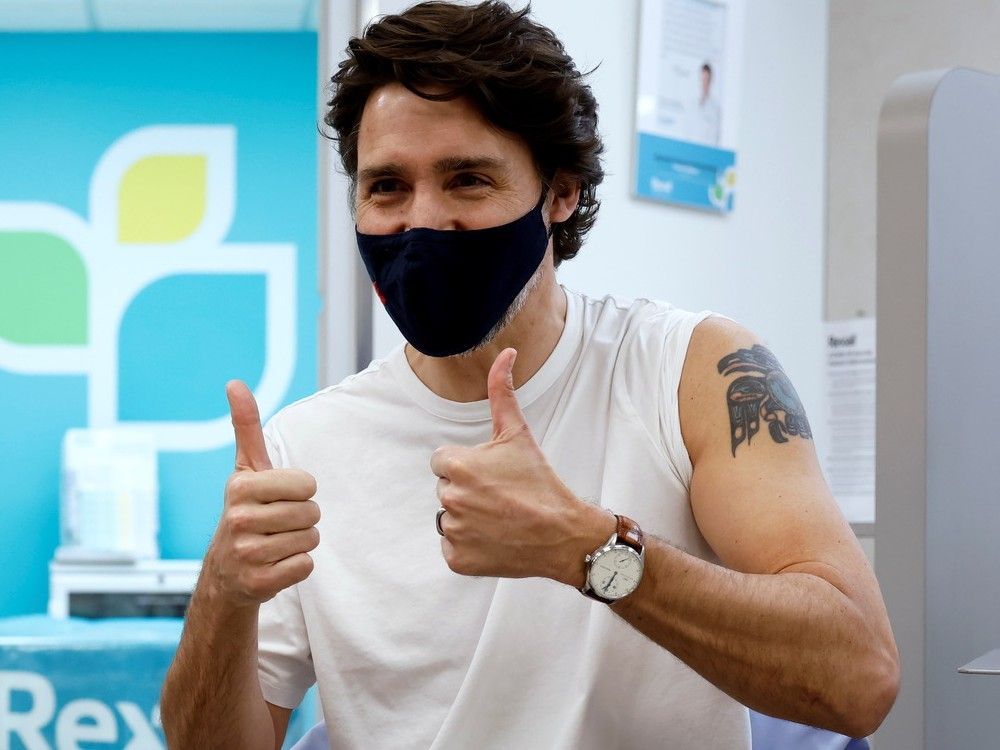 Canada's Prime Minister Justin Trudeau reacts after being inoculated with AstraZeneca's vaccine against coronavirus disease (COVID-19) at a pharmacy in Ottawa, Ontario, Canada April 23, 2021. 