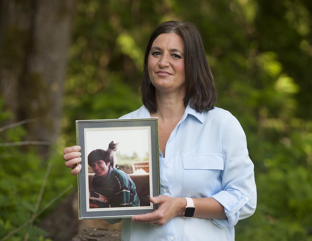 Shazia Mele holds a photo of her special needs sister, Samina.