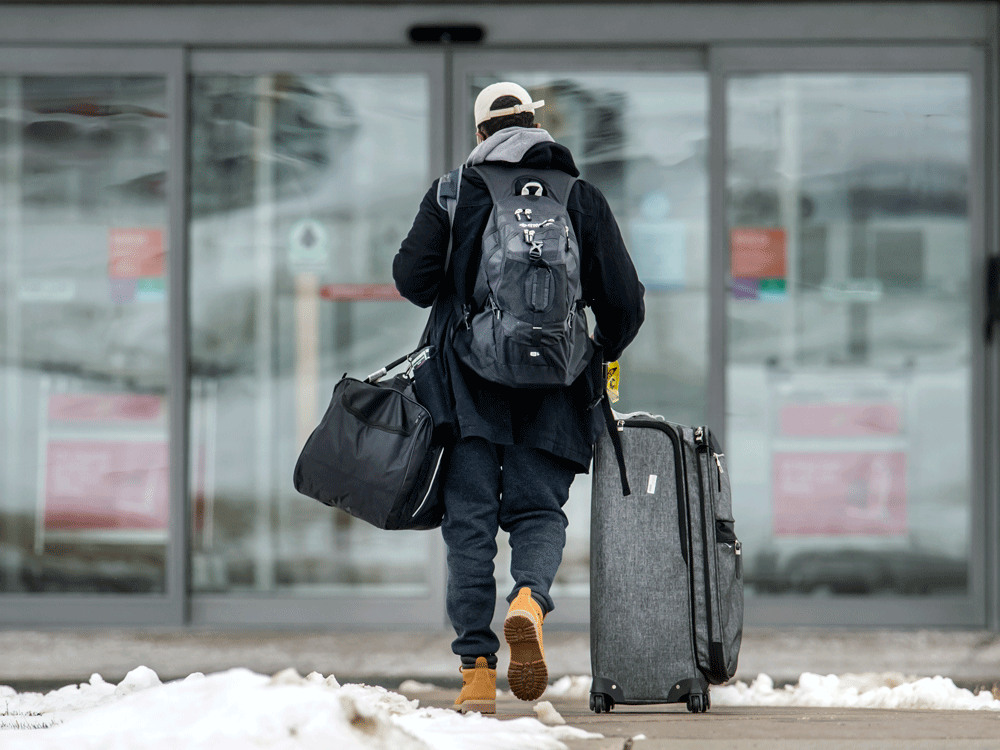 a traveller arrives for a mandatory hotel quarantine near toronto’s pearson airport during the covid-19 pandemic, february 22, 2021.