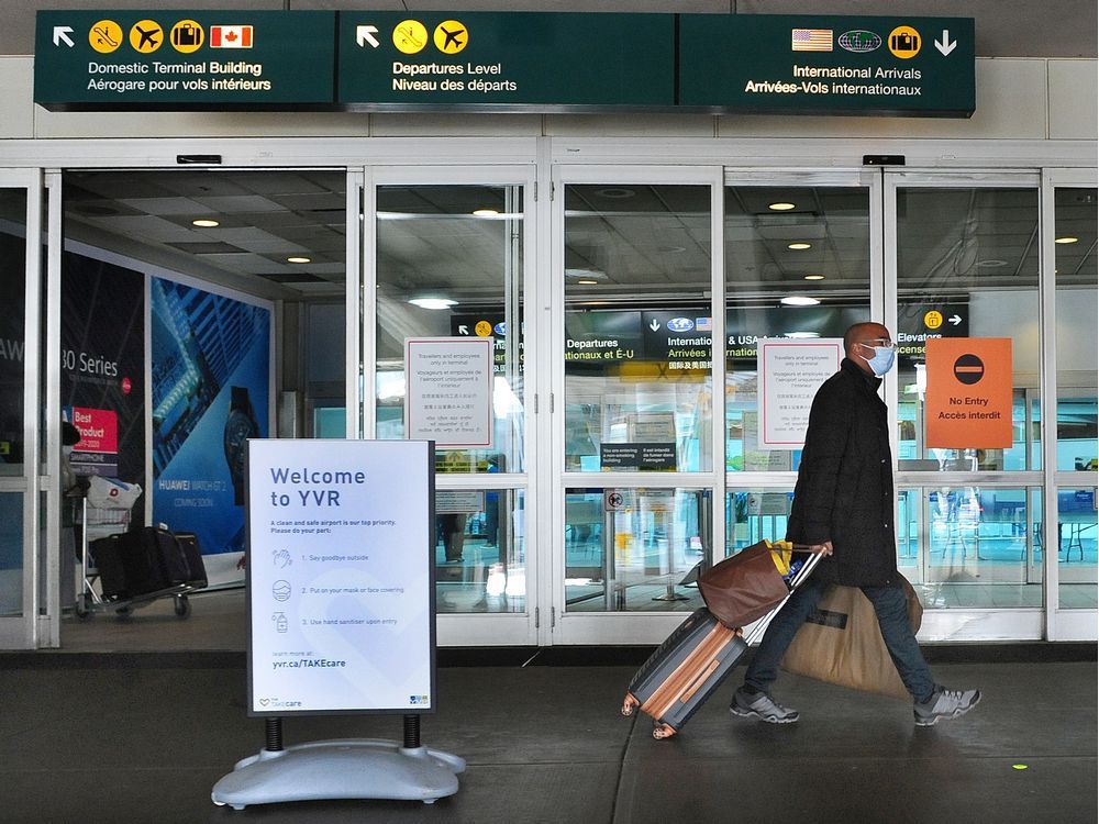 a traveller at vancouver international airport shown on feb. 22, 2021.