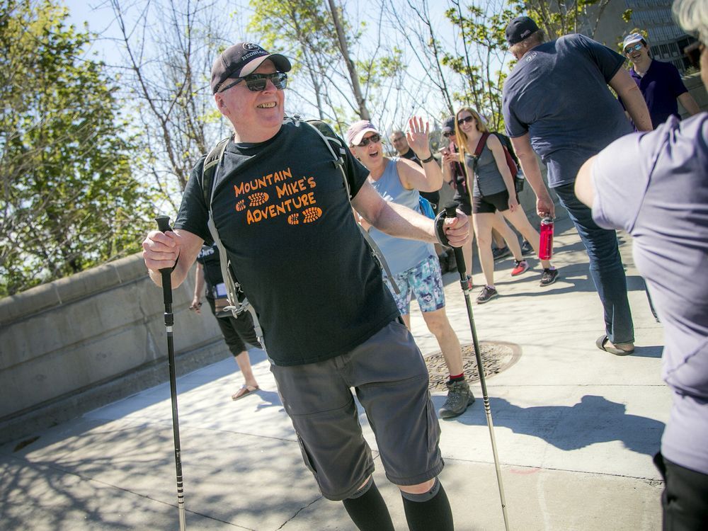 despite suffering from incurable prostate cancer that has spread to his hip bones, 72-year-old michael baine once again took part in race weekend. baine was all smiles sunday as he received constant support along his route from friends and loved ones.