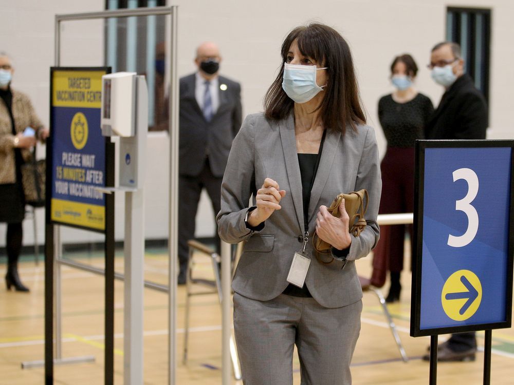 theresa marentette, ceo of the windsor-essex county health unit, leads a tour of the covid-19 vaccination clinic at the nature fresh farms recreation centre in leamington on march 10, 2021.