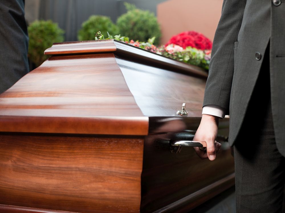 File photo of a coffin being carried during a funeral.