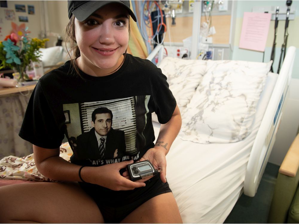 sacha cardinal, 17, holds the accu-chek diaport system, a highly specialized device made by roche that infuses insulin into the abdominal cavity.