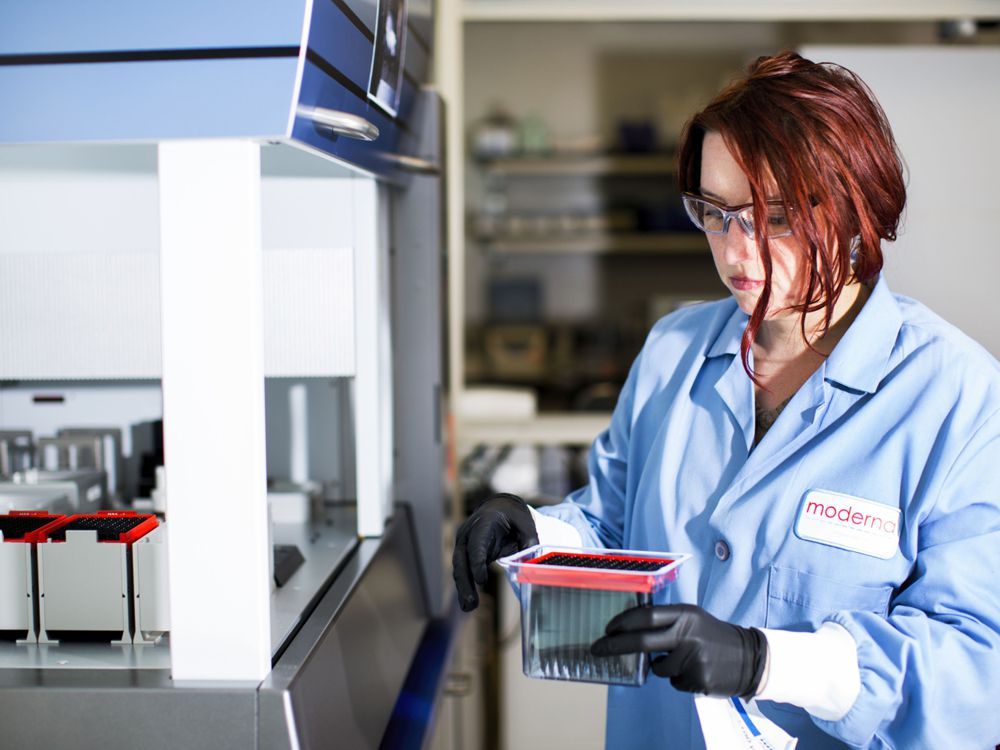 a research associate works at the moderna lab in cambridge, massachusetts, in 2017.