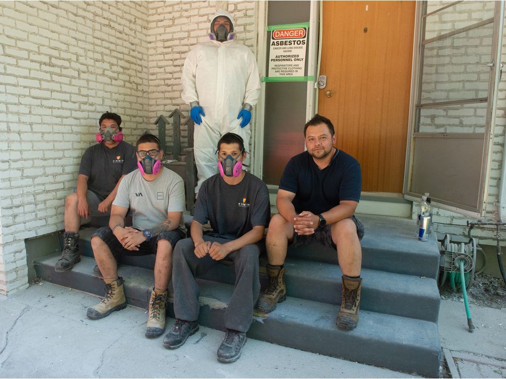 from left, kylan anaskan, dalton anaskan, gerald anaskan, austin stonechild and felipe barradas sit in front of home they are currently working on in the south end of regina. barradas owns a company called firmin abatement specialists inc., which does asbestos removal. he and his crew, pictured here, were in the midst of removing asbestos from an older home.