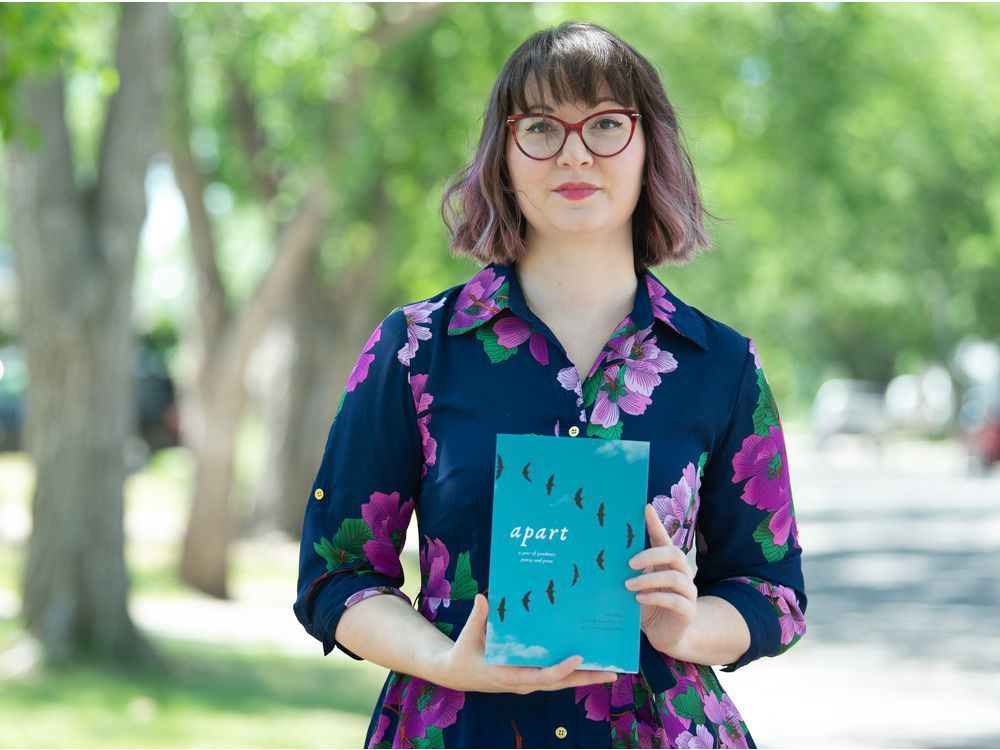 courtney bates-hardy, associate poetry editor of the new book "apart: a year of pandemic poetry and prose," holds a copy of the book near her home in regina, saskatchewan on july 2, 2021. brandon harder/ regina leader-post