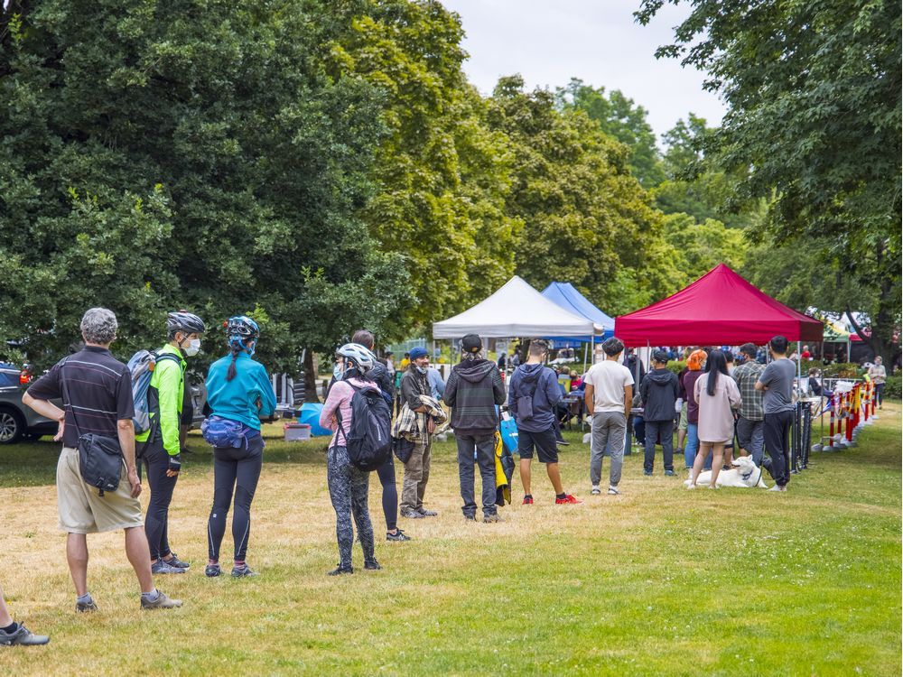 lineup to get vaccinated on saturday, july 17 at the trout lake farmer's market.