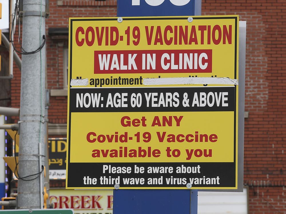 a covid-19 vaccination sign at the neighbourhood drug store on wyandotte street east in windsor is shown in april 2021.