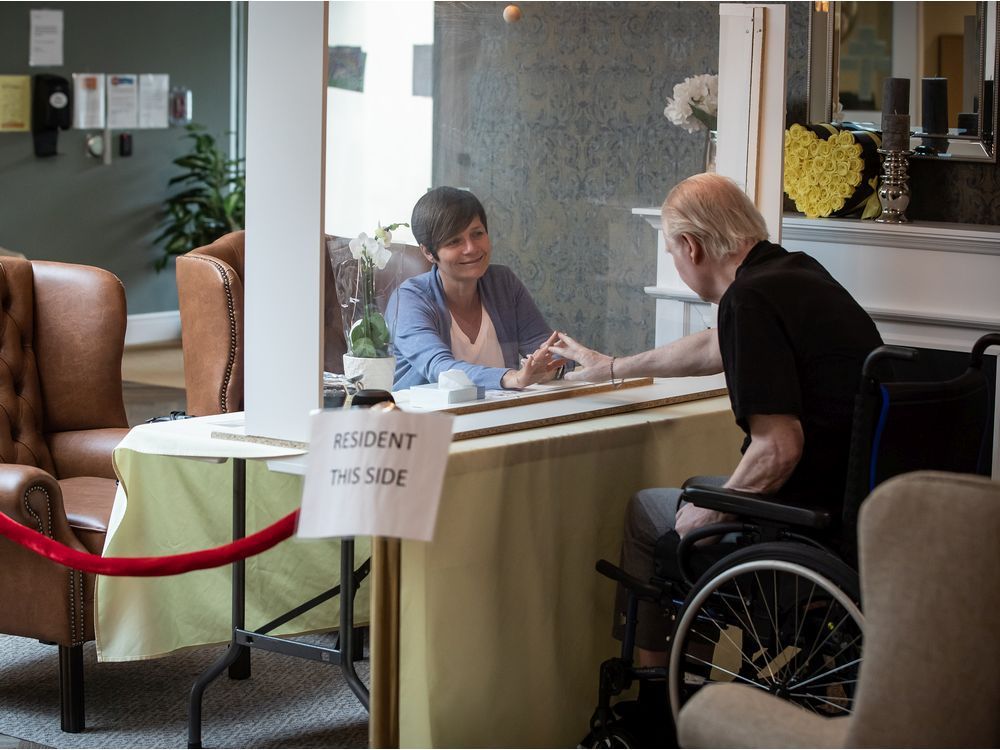 cp-web. christine lorimer, left, and her loved one ian lorimer's hands meet at a plexiglass barrier during a visit at lynn valley care centre, in north vancouver, on thursday, july 16, 2020. two residents per day are now allowed to have pre-scheduled visitors in the designated area with a barrier between them, however they aren't allowed to touch, hug or kiss. visitors have their temperature checked and are given a screening questionnaire upon arrival. the seniors care home, which is now covid-19 free, recorded canada's first death from the virus on march 8.