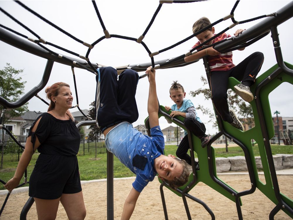 rebecca genest watches her children james, 9, front, noah, 5, and owen, 8, at a playground near their home in buckingham, que. they are preparing to relocate to radisson, population 500, in the james bay region, where she has a job, and where she is hoping they will avoid the covid-19 shutdowns that disrupted the last school year.