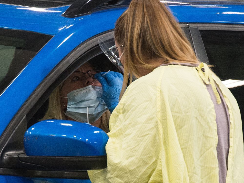 a health worker demonstrates how a covid-19 swab test would be conducted at the saskatchewan health authority drive-thru covid-19 testing facility in regina, saskatchewan on sept. 8, 2020. brandon harder/ regina leader-post