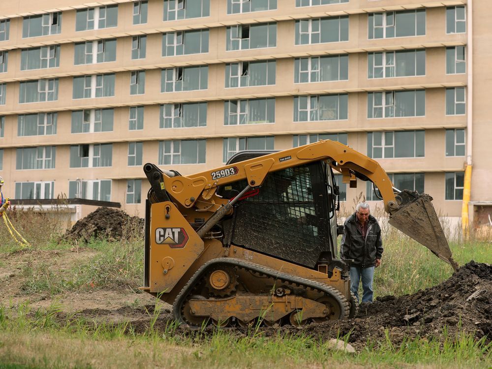 elder fernie marty from the papaschase first nation, monitors the covering of dig sites on the grounds of the former charles camsell hospital, in edmonton friday aug. 6, 2021. eleven sites were excavated on the grounds of the former hospital thursday aug. 5 after ground penetrating radar identified anomalies. no human remains or artifacts were found in the 11 sites, but papaschase first nation oral history says there are unmarked graves on the north east section of the property, which have not yet been searched. the hospital had served as a tuberculosis treatment centre for indigenous peoples. photo by david bloom