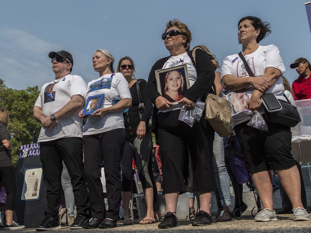 families who have lost loved ones gather in front of the legislature with photos of their loved ones. edmonton's international overdose awareness day event on the steps of the alberta legislature. file photo.